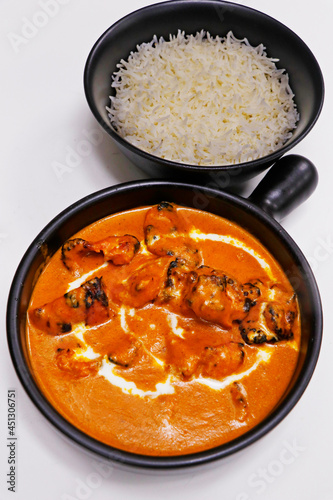 butter chicken curry with jeera rice, indian food delicacy, chicken cooked in rich tomato cashewnut gravy