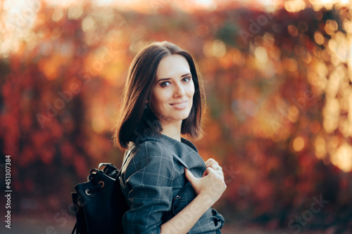 Smiling Female Student Wearing a Backpack © nicoletaionescu