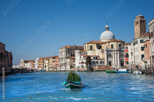 the boat carries a fir tree on the Grand Canal, Venice, Italy, 2019. march