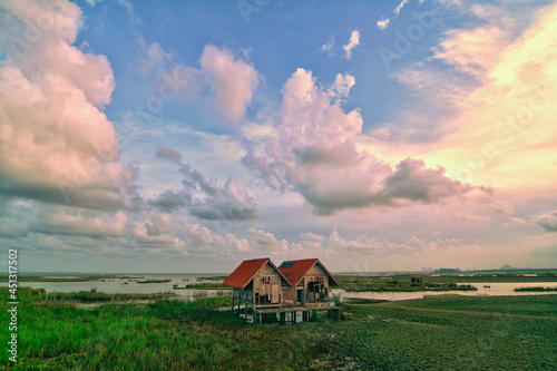 Landscape abandoned wooden house in rural Phatthalung province, southern Thailand photo