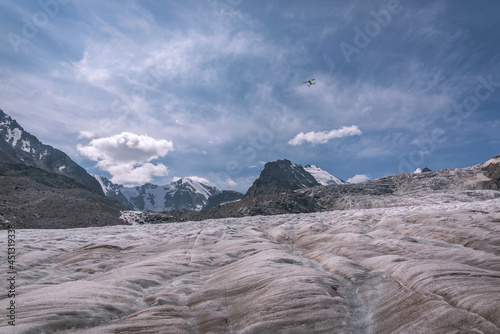 glacier mountains ice snow clouds sky drone