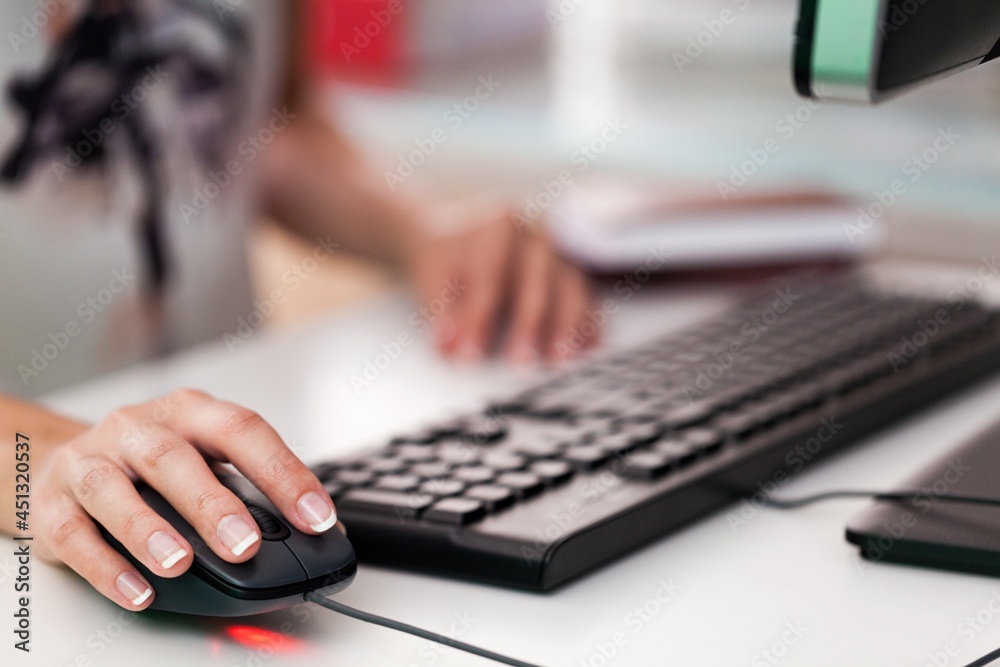 Closeup of Woman's Hand Using a Mouse Closeup of Woman's Hand Using a Mouse