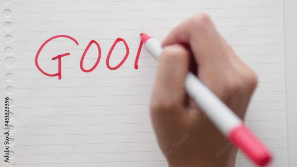 man writing word good in capital man writing word good in capital