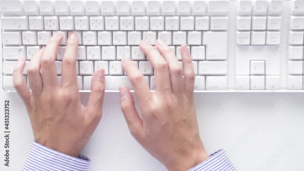 man typing on a keyboard