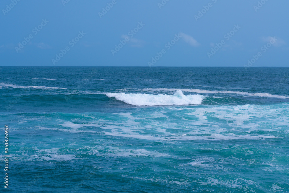 Fototapeta premium Beautiful strong blue waves in the sea.