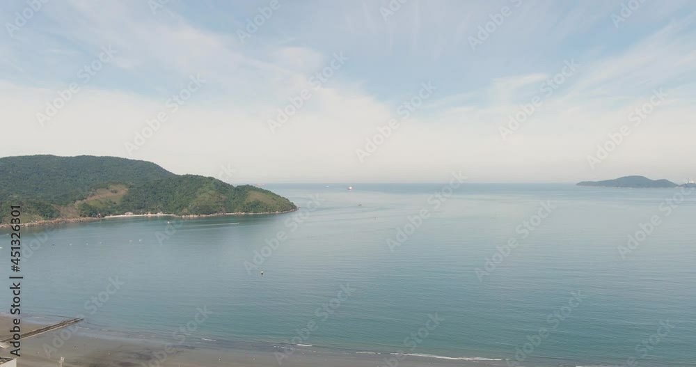 Aerial flying backwards over Santos Bay on sunny day, Brazil Aerial flying backwards over Santos Bay on sunny day, Brazil