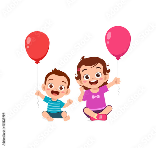 cute little girl play balloon with baby sibling