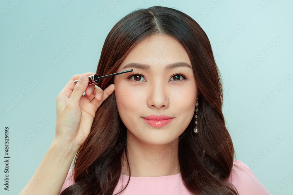beautiful young woman applied mascara, studio beauty portrait beautiful young woman applied mascara, studio beauty portrait