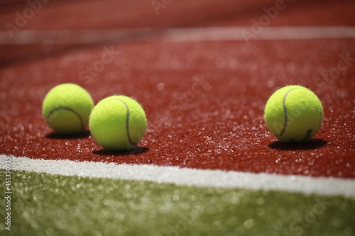 Tennis balls on a tennis court © BillionPhotos.com