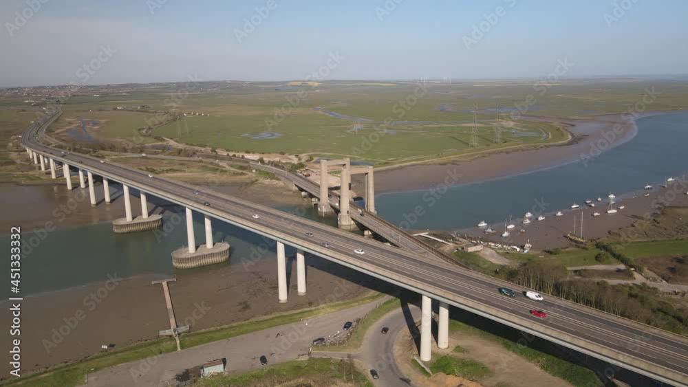 Smooth Traffic At Kingsferry Bridge And Sheppey Crossing Across The Swale Channel In Sittingbourne, United Kingdom. aerial Smooth Traffic At Kingsferry Bridge And Sheppey Crossing Across The Swale Channel In Sittingbourne, United Kingdom. aerial
