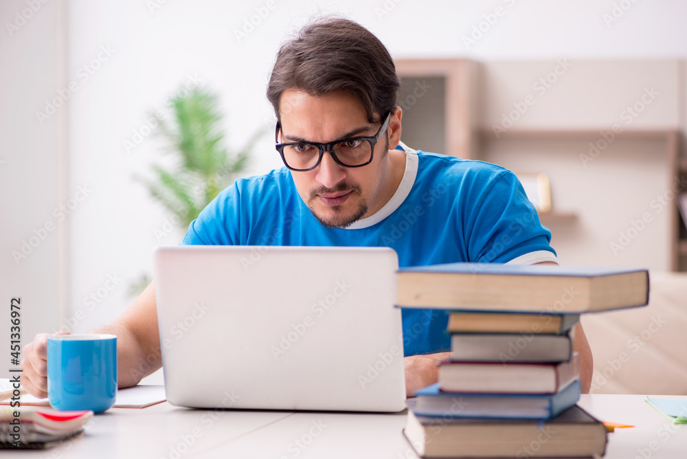 Young male student studying at home Young male student studying at home