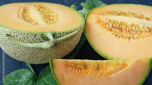 Top view Rotate Sweet Hokkaido melons on wooden table, Fresh Japanese Hokkaido melons very sweet and juicy.