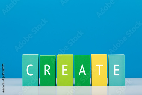 Minimal colorful concept of brainstorming, innovation, invention and new ideas. Multicolored blocks in a row with word create