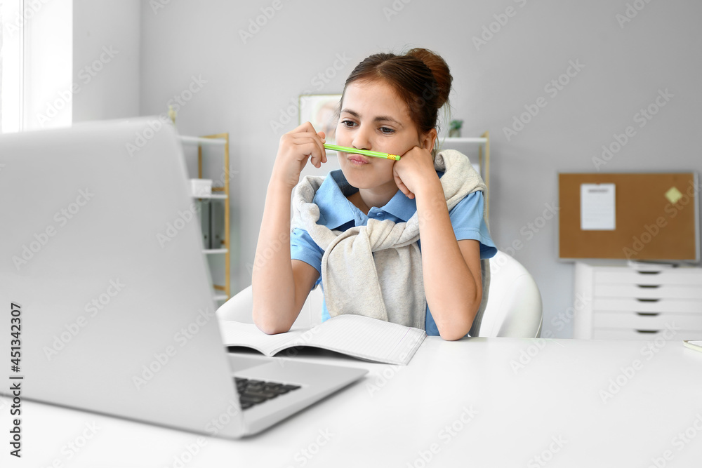 Little schoolgirl studying online at home Little schoolgirl studying online at home
