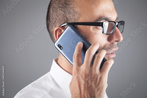 Young businessman talking by mobile phone. © andranik123
