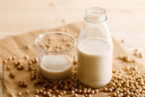 soy milk in a bottle on wooden table