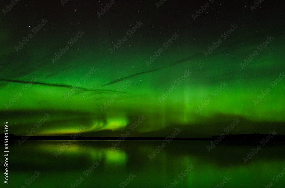 Aurora borealis, The Northern lights at the lake, Latvia.