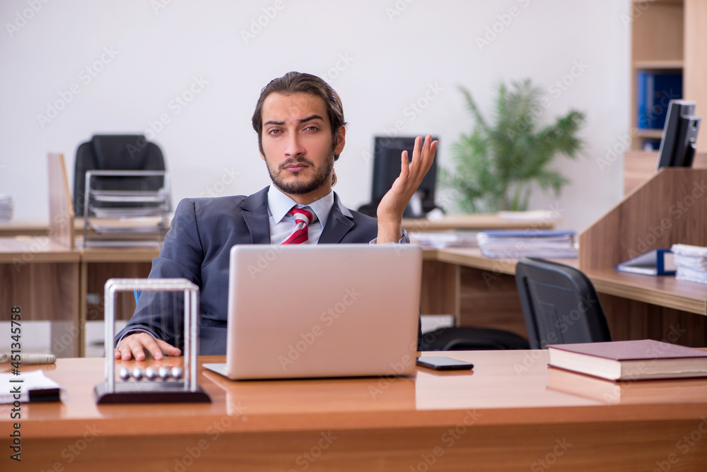 Young man businessman employee sitting in the office Young man businessman employee sitting in the office