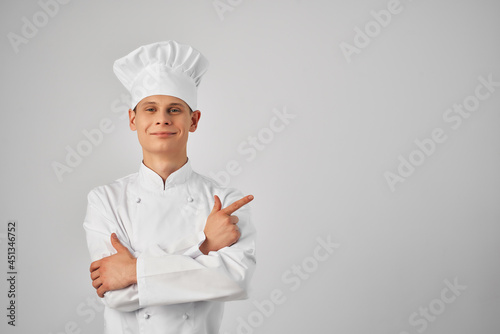 Cheerful male chef gesturing with his hands kitchen restaurant professional