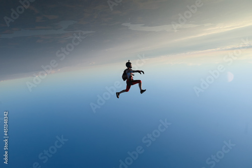 Skydiving. Freefly jump. A girl is having fun in the sky.