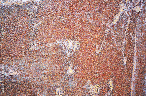 Background of old weathered iron texture. Close-up of red rusted iron surface photo