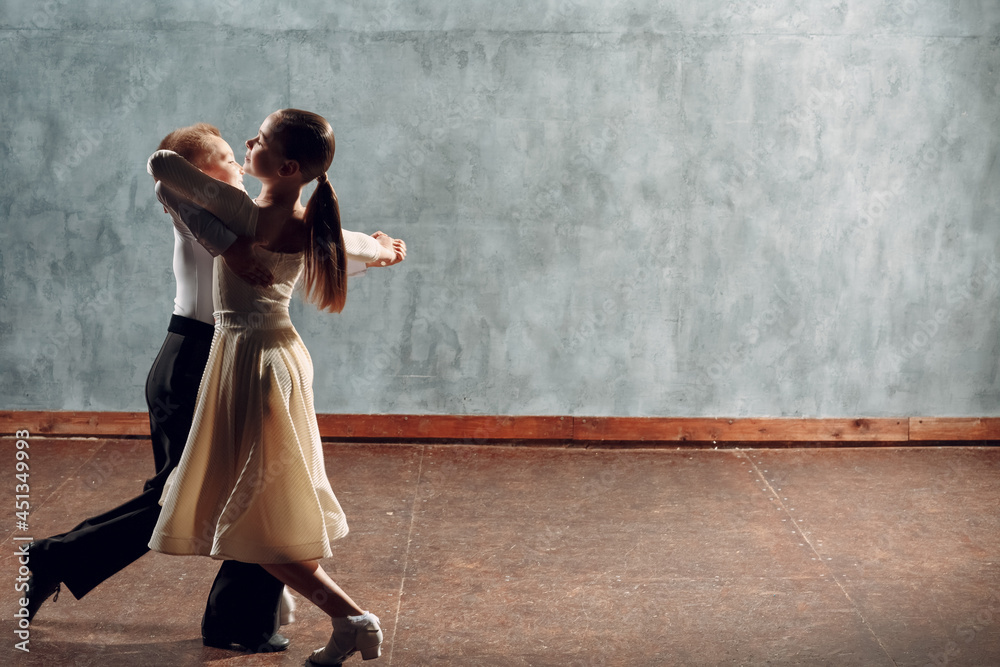 Young couple boy and girl dancing in ballroom dance Viennese Waltz. Young couple boy and girl dancing in ballroom dance Viennese Waltz.