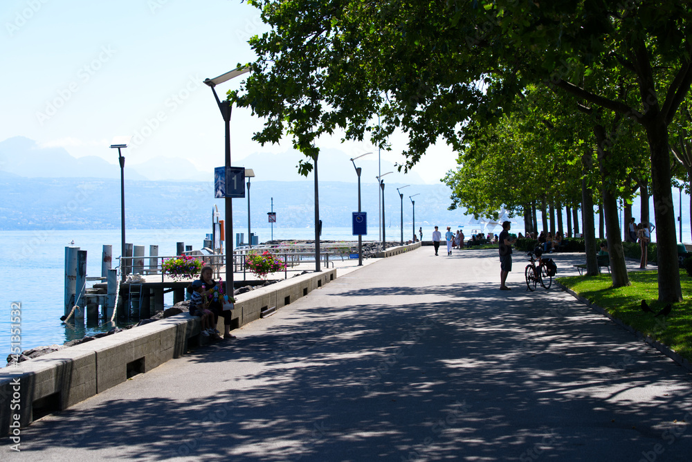 Idyllic pier at Lake Geneva on a sunny summer day. Photo taken July 29th, 2021, Lausanne, Switzerland.