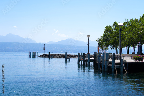 Idyllic pier at Lake Geneva on a sunny summer day. Photo taken July 29th, 2021, Lausanne, Switzerland. © Michael Derrer Fuchs