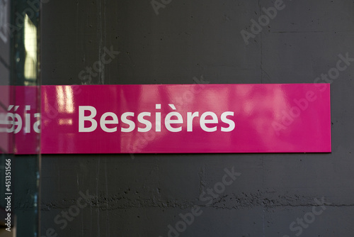 Pink sign with white text at Metro station Bessières at City of Lausanne. Photo taken July 29th, 2021, Lausanne, Switzerland. photo