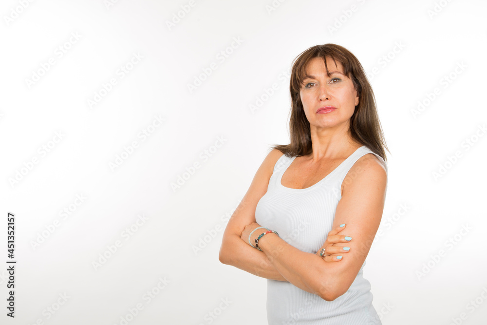 senior caucasian woman with safety pose with arms crossed on white background senior caucasian woman with safety pose with arms crossed on white background