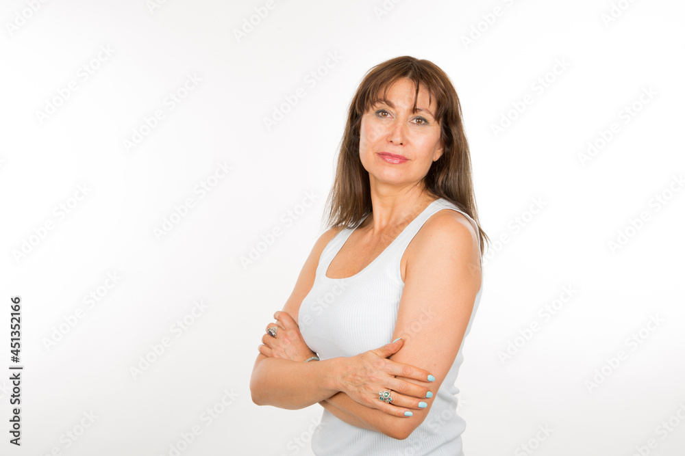 senior caucasian woman with safety pose with arms crossed on white background senior caucasian woman with safety pose with arms crossed on white background