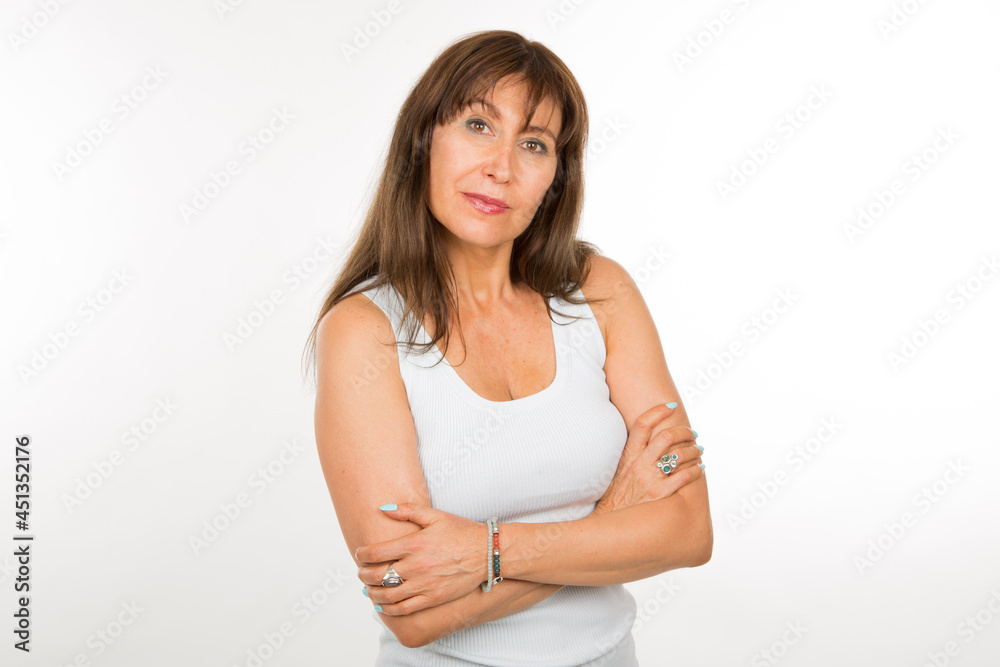 senior caucasian woman with safety pose with arms crossed on white background senior caucasian woman with safety pose with arms crossed on white background