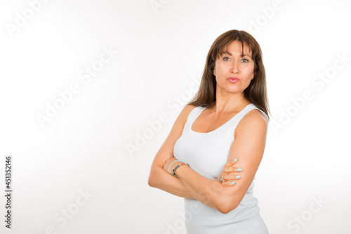 senior caucasian woman with arms crossed on white background © luisrojasstock