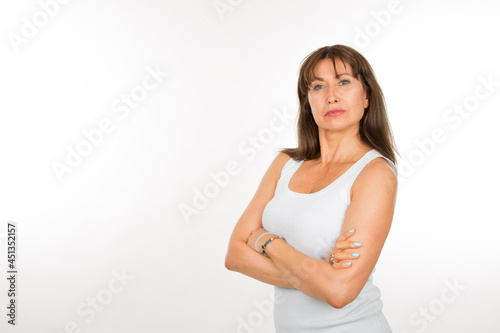 senior caucasian woman with safety pose with arms crossed on white background