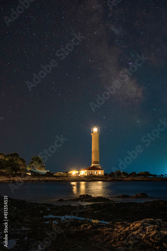 Lighthouse of Veli Rat on the island of Dugi Otok, Croatia, starry night sky in background