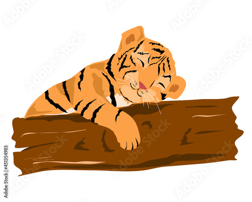 A little tiger cub sleeps near a tree.