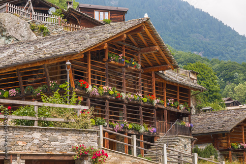 Flowering balcony in the house of Alagna alpine village at the feet of Monte Rosa, Valsesia, Piemonte photo