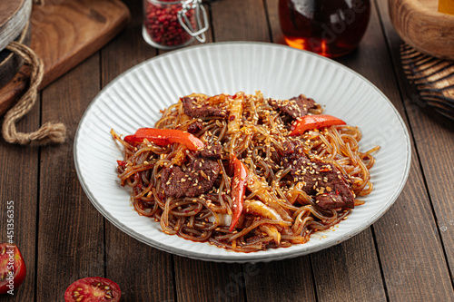 Asian beef soba noodles with peppers and sesame seeds