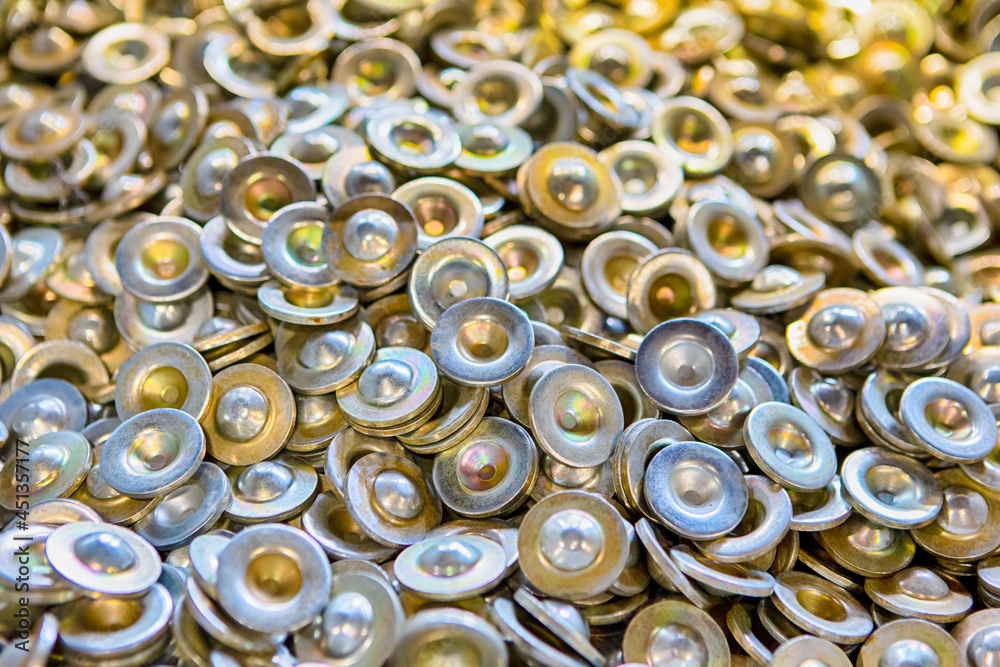 Variety of Newly Produced Stainless Steel Shiny Washers Placed Together Bulk.