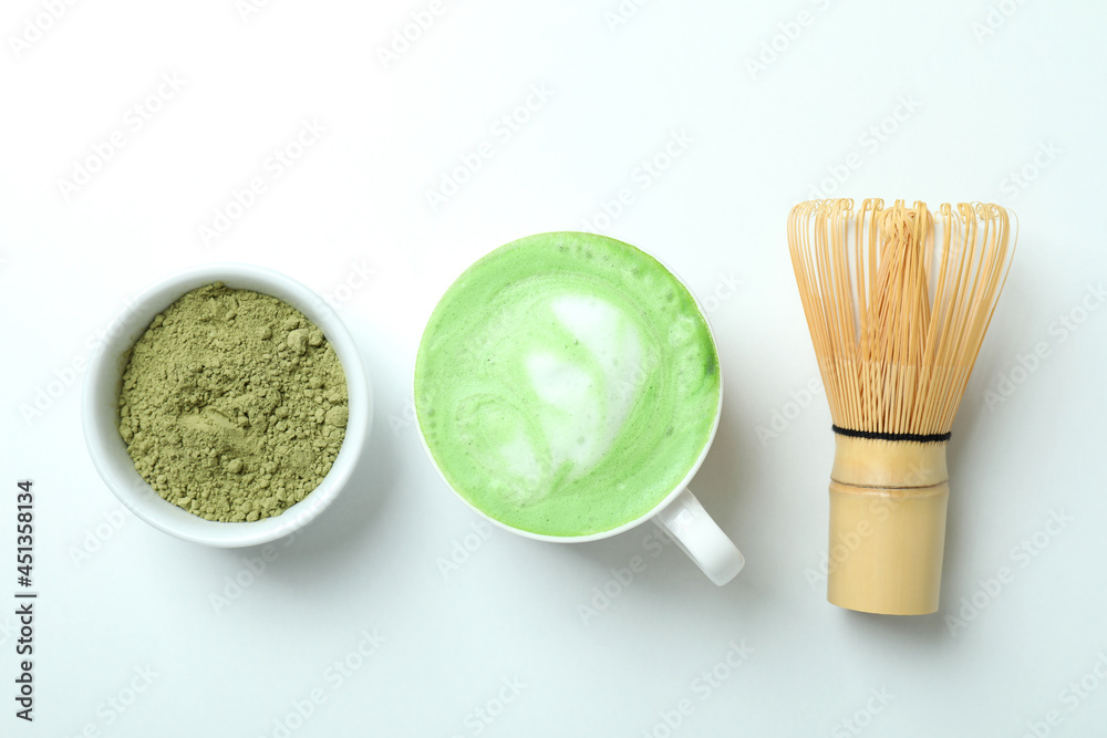 Matcha latte and accessories for making on white background Matcha latte and accessories for making on white background
