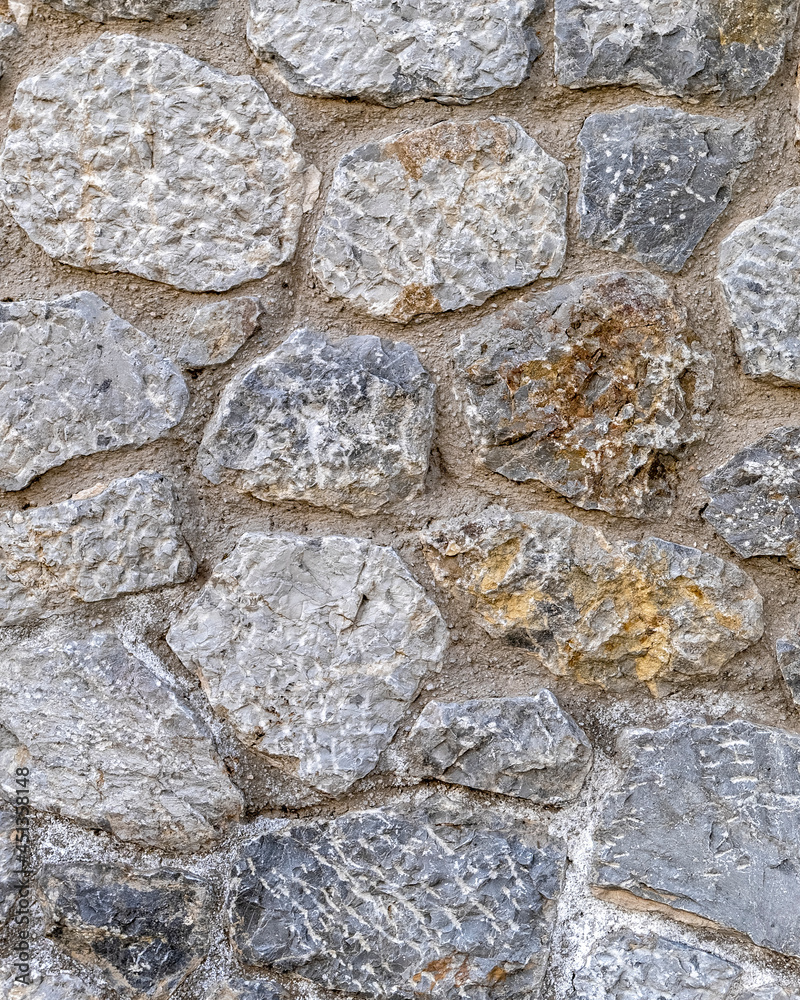 random cut stone wall, seamless natural background random cut stone wall, seamless natural background