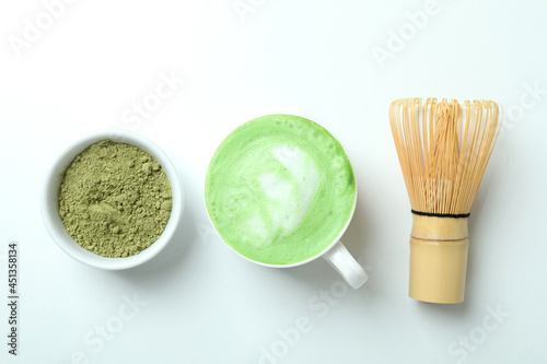 Matcha latte and accessories for making on white background