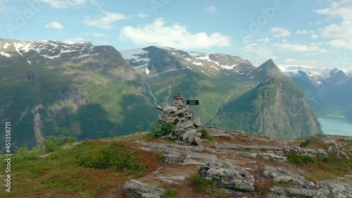 Pile Of Rocks At The Summit Of The Mountain Overlooking The Oldeelva River At The Valley Of Oldedalen In Olden, Norway. aerial, orbit photo