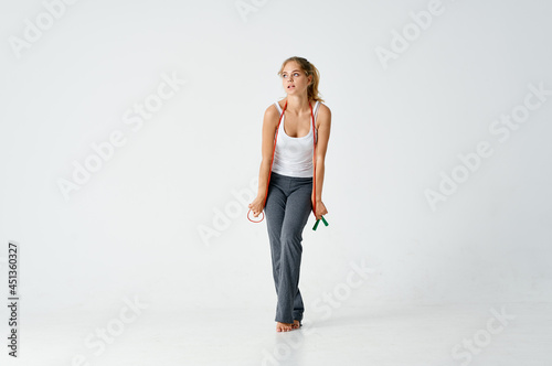 athletic woman exercising with skipping rope motivation slim figure