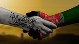 Afghans shake hands with the new Taliban government