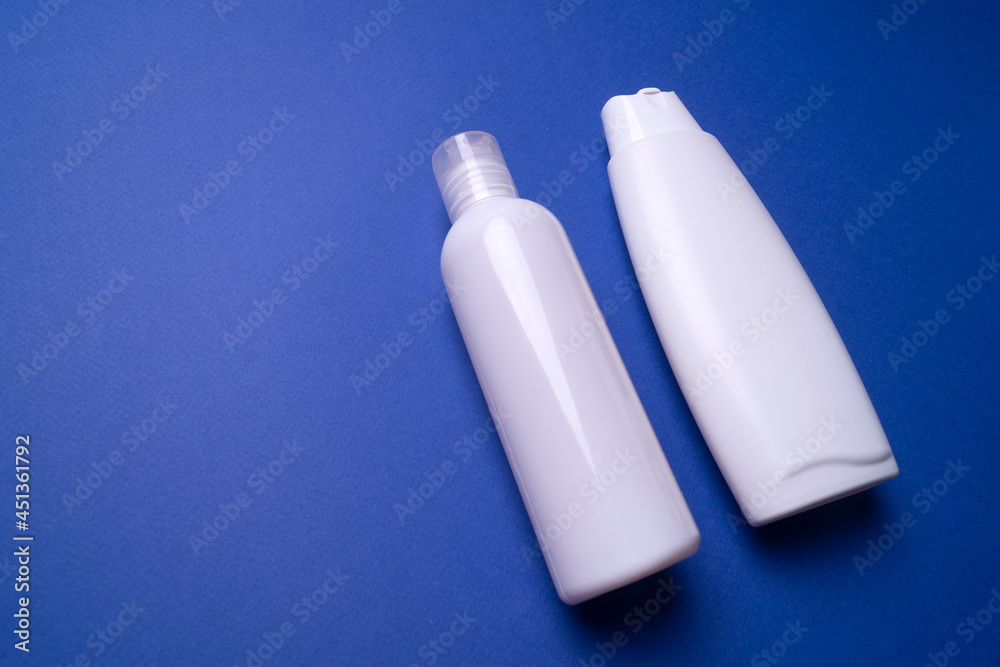shampoo or hair conditioner bottle isolated on blue background shampoo or hair conditioner bottle isolated on blue background