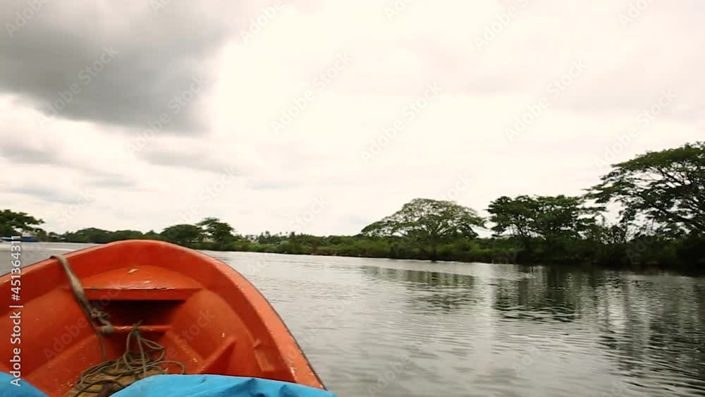 Boat travels across Fijian river transporting people to island, smooth motion Boat travels across Fijian river transporting people to island, smooth motion