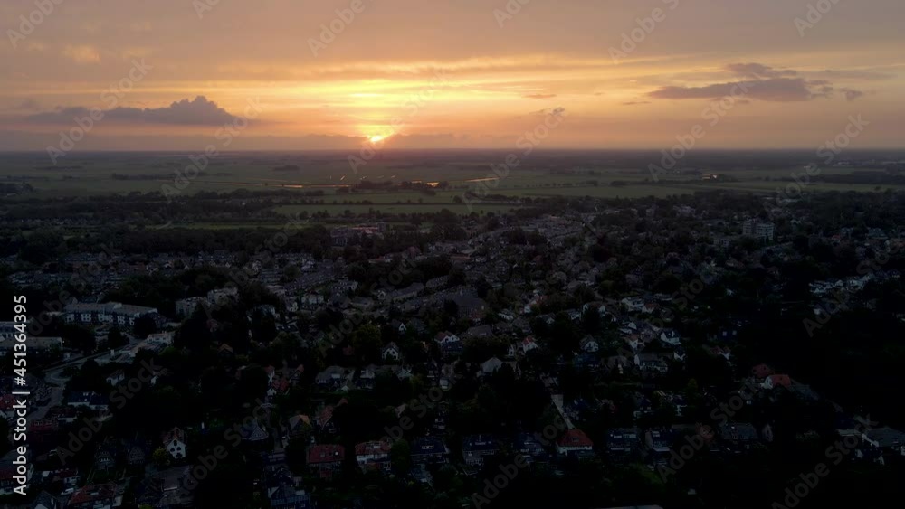 High aerial of rustic, small town at sunrise High aerial of rustic, small town at sunrise