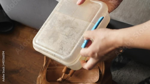 opening a lunchbox lunch bag  with rotten moldy sandwiches school backpack