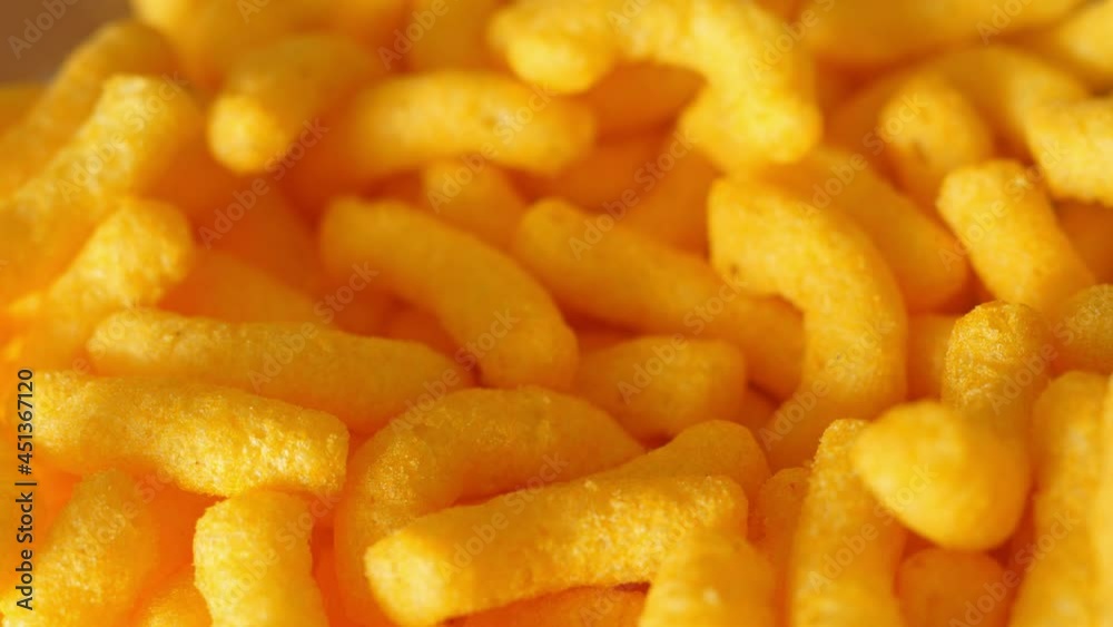 taking cheese crisps chips snacks from a bowl party snack